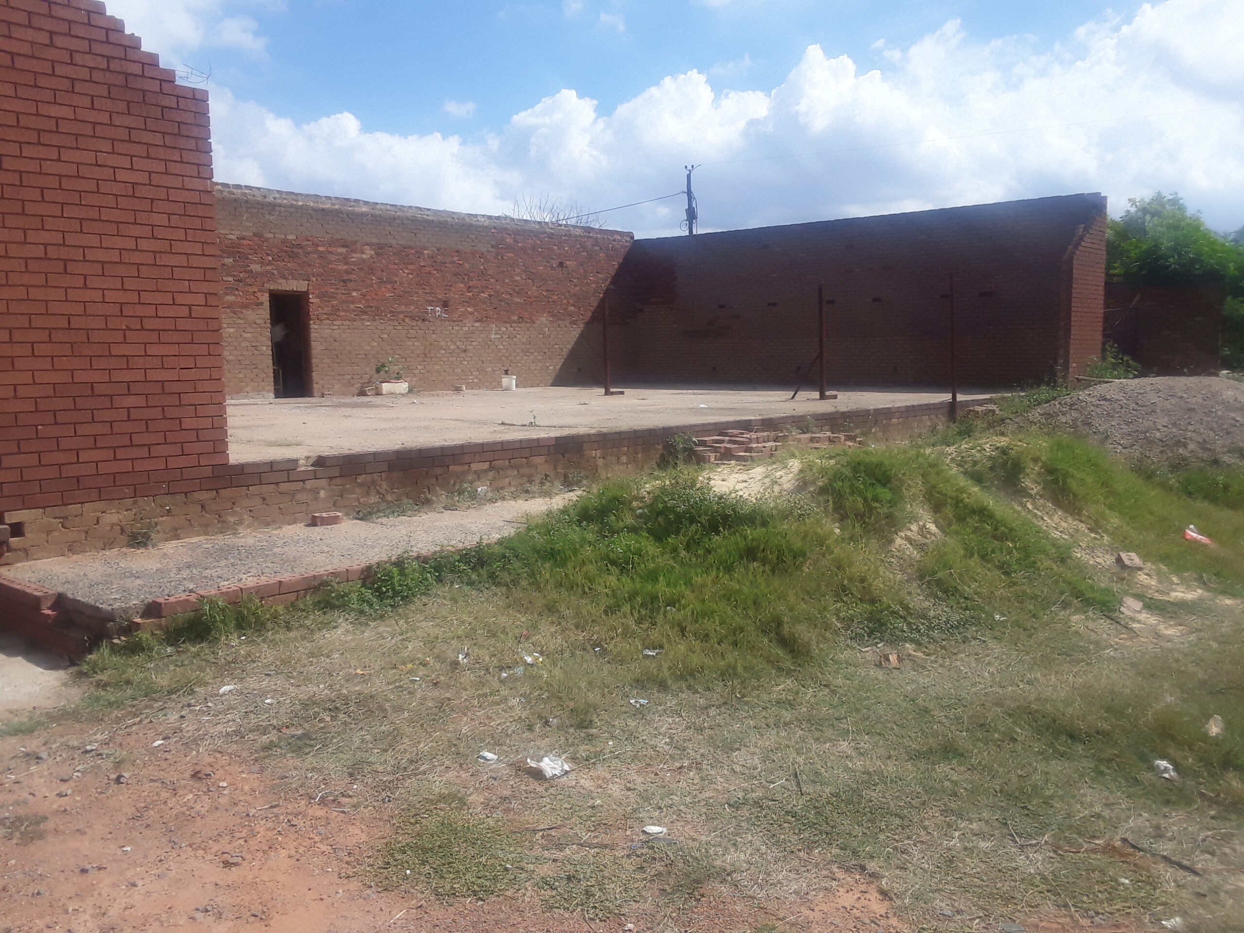 THREE STANDS WITH BUILDING